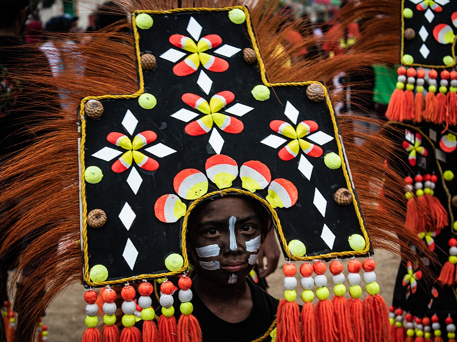 Soot painted faces in the streets of Kalibo
