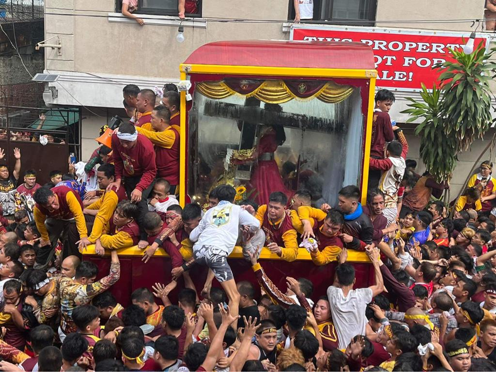 The Black Nazarene carriage pulled through the crowd