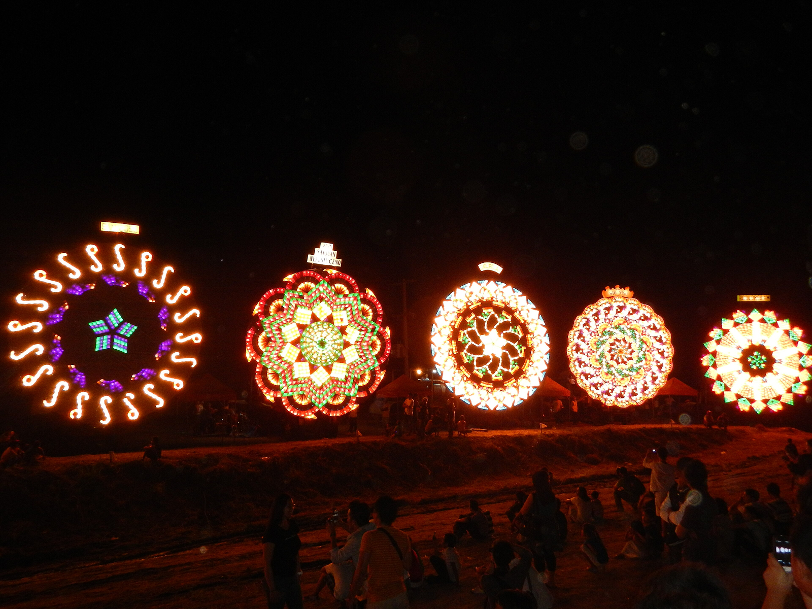 A fifteen foot parol lit up at night