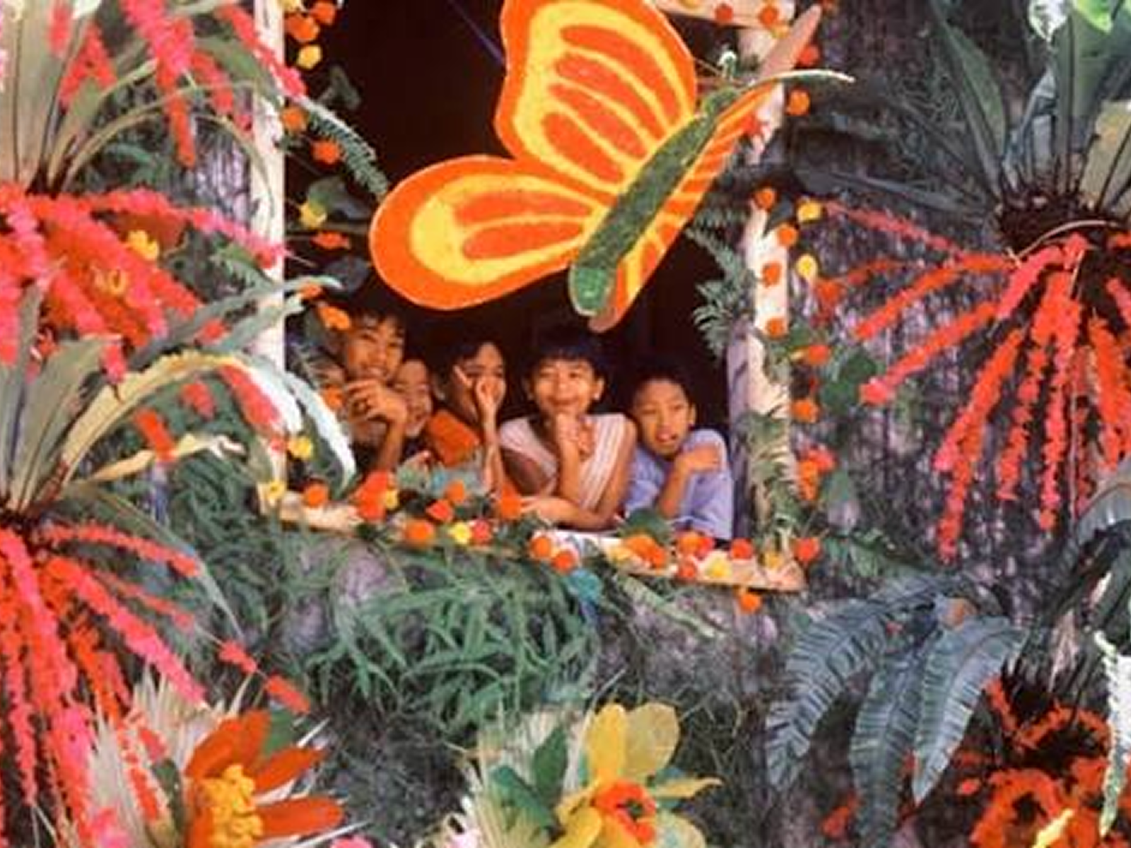 A family peeling kiping off their own wall to eat